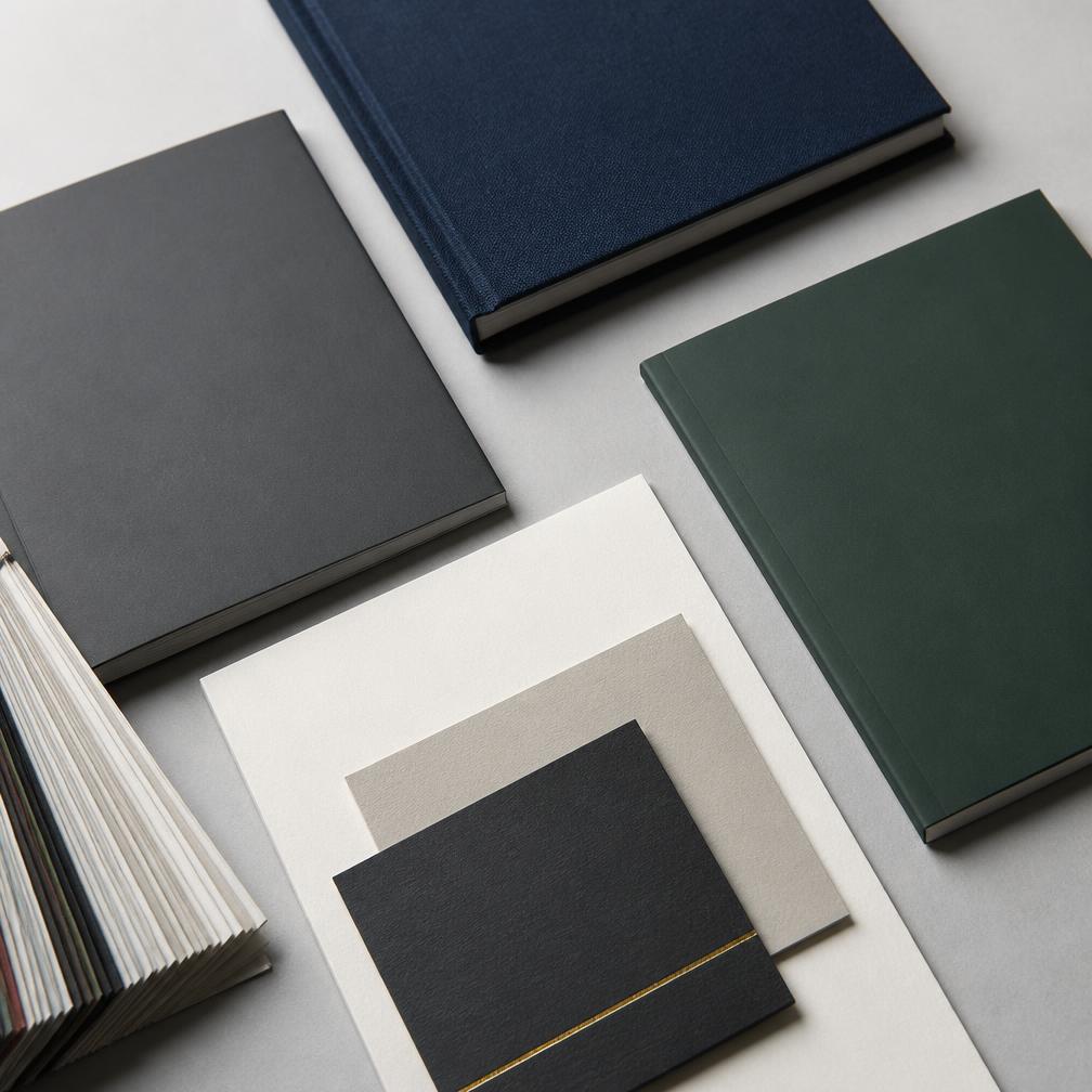 Premium uncoated paper stock swatches fanned on a white surface